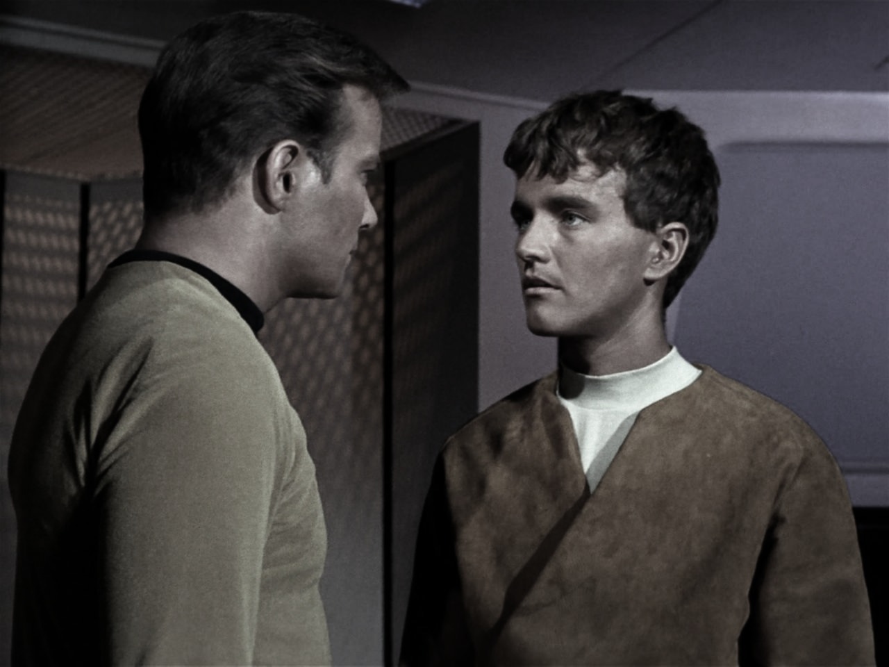 "On the bridge of the Enterprise, Kirk’s voice carried the weight of command and compassion as he confronted Charlie. The boy’s defiance wavered, his gaze darting between the captain and the crew. The shadow of the S.S. Antares loomed over them all—a testament to the consequences of unchecked power and the fragile line between humanity and hubris."