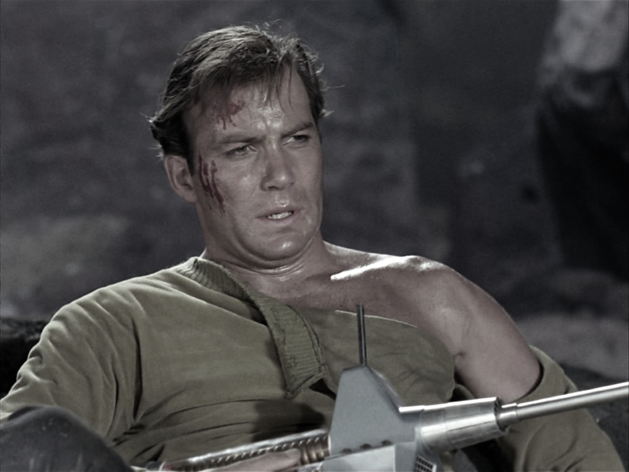 "Amidst the rubble and dust, Kirk staggered back, his uniform torn, his breath heavy with the weight of victory. The phaser rifle lay discarded, a silent witness to the battle’s end. In his eyes, a flicker of sorrow and resolve—a captain’s burden, a triumph hard-won."