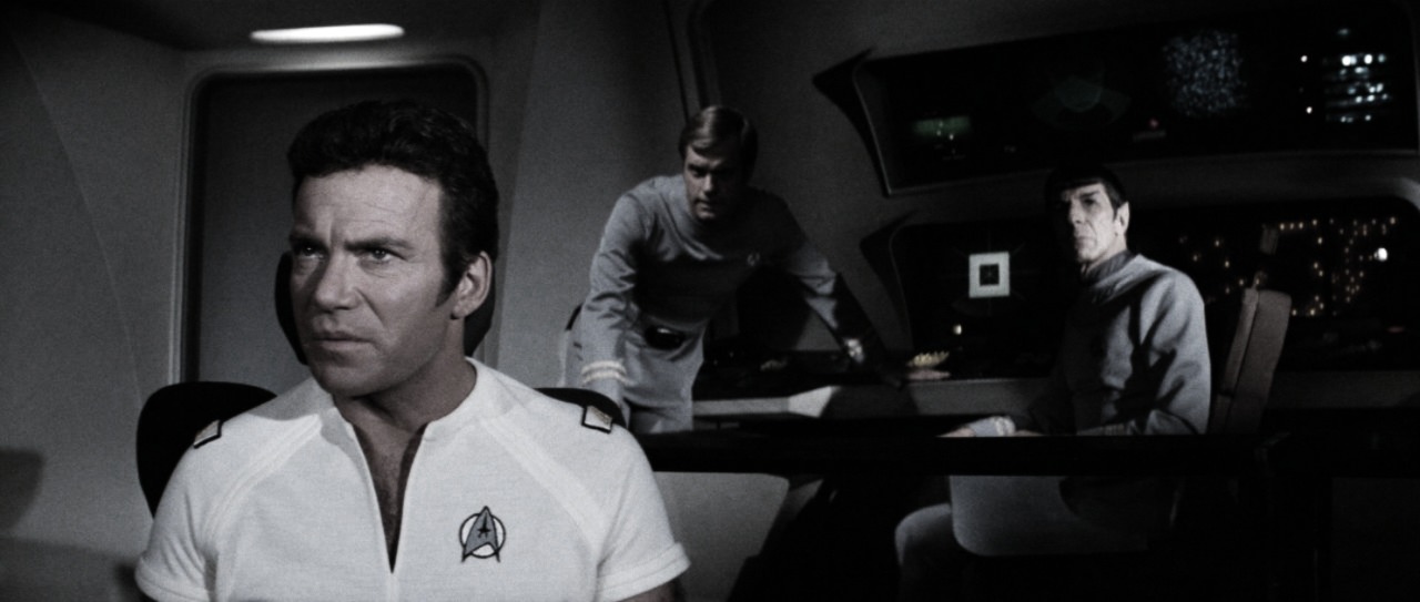 "Upon the bridge, Kirk’s gaze steadied—understanding dawning as V’Ger’s purpose became clear. Behind him, Decker and Spock watched in silence, witnesses to revelation."