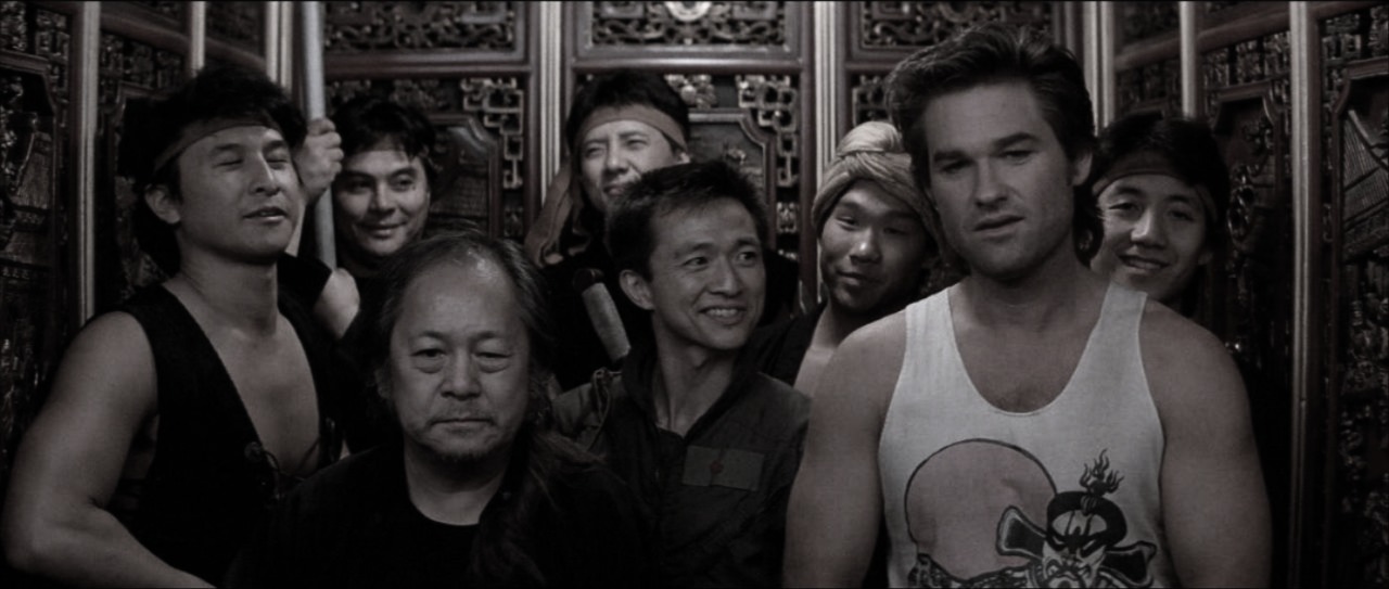 "Within the gilded confines of the elevator, Jack and Egg Shen stood amidst the Chang Sings, their spirits buoyed by the elixir’s potent charm. The air hummed with camaraderie and anticipation, a fleeting respite before the storm. Jack’s grin betrayed a rare moment of ease, while Egg Shen’s eyes sparkled with ancient wisdom, a silent promise of triumph yet to come."
